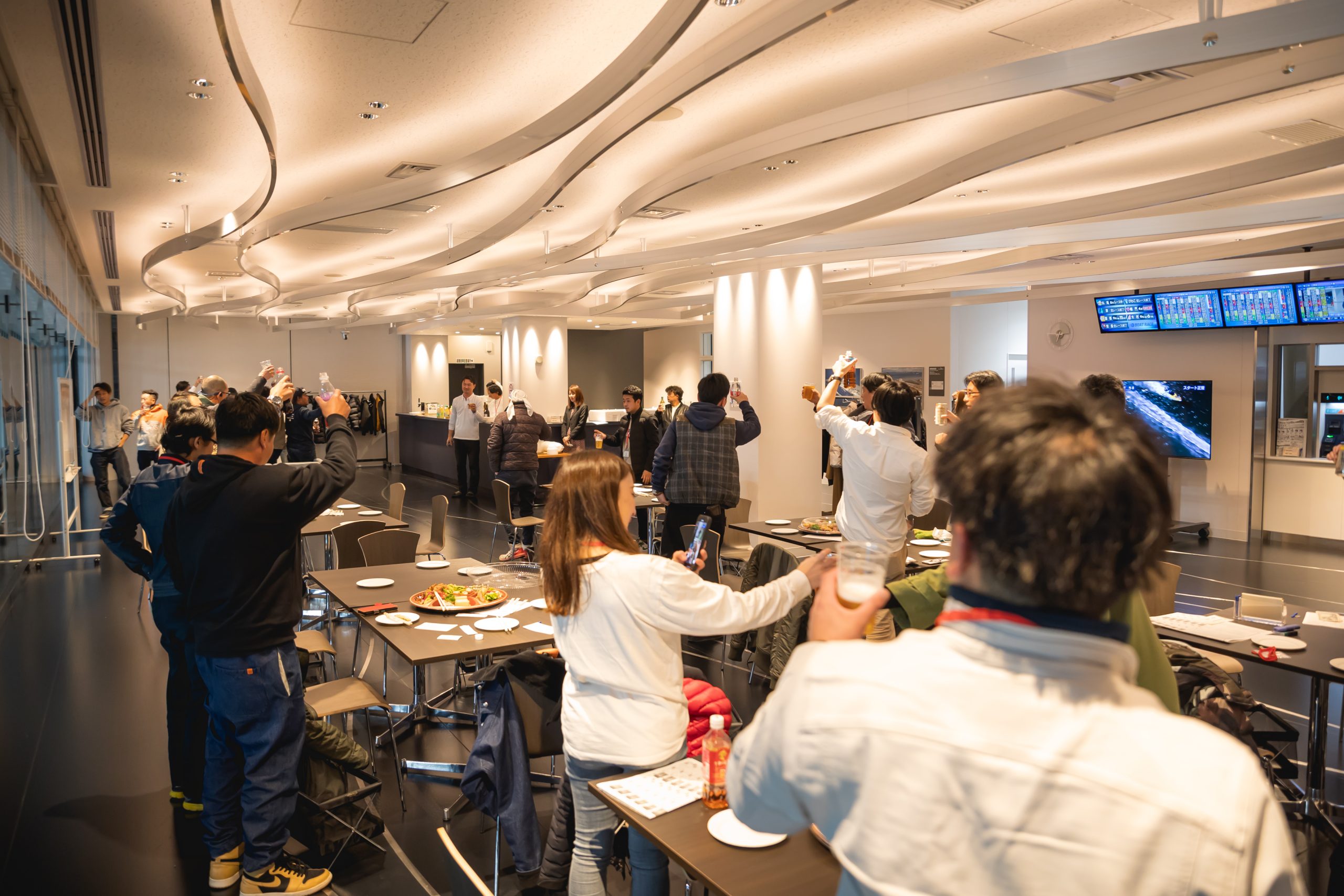 With株式会社の忘年会の乾杯の様子